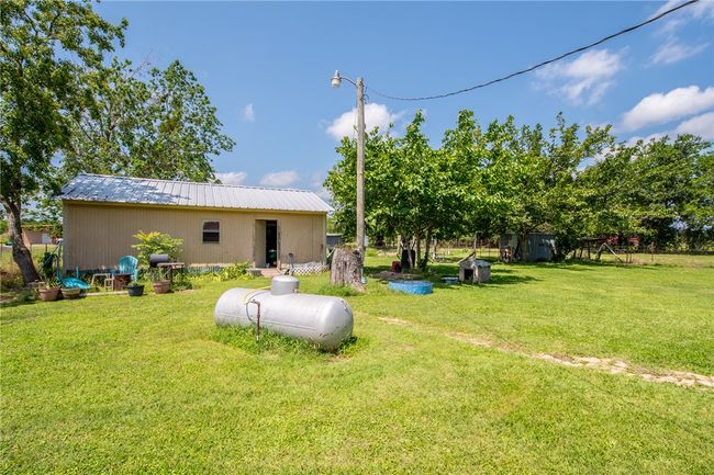 View of grassy yard with an outdoor structure | Image 33