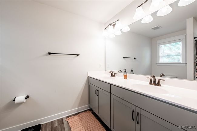 Ensuite Bathroom with wood finished floors and double vanity | Image 21