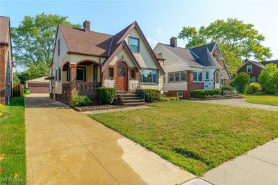 English style home with a front yard | Image 2