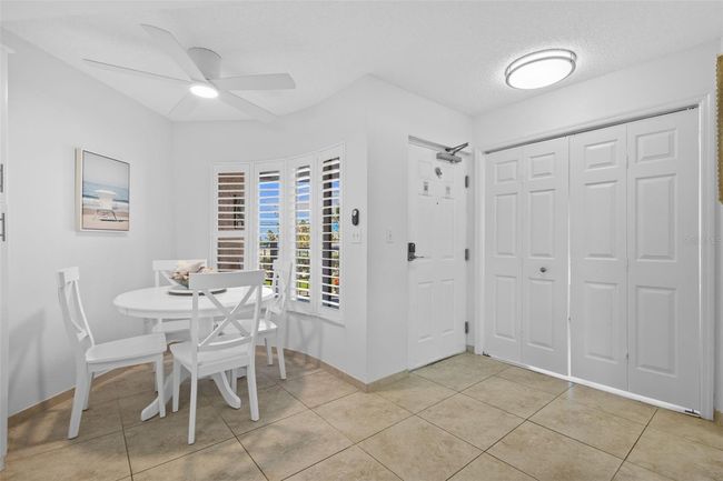 Entry and Dining area near bay windows with plantation shutters | Image 5