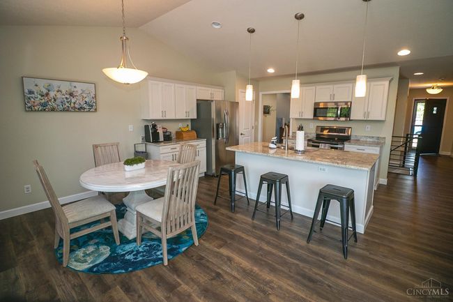 Kitchen with granite counters, bar height. All appliances (stainless steel) convey. | Image 5