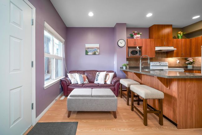 Living area with baseboards, recessed lighting, and light wood-style floors | Image 10