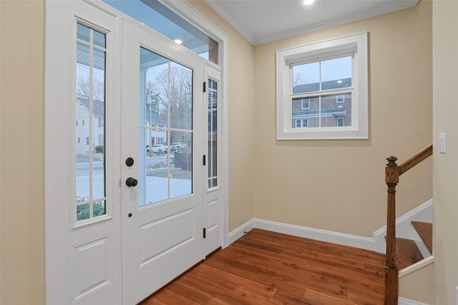 Entryway with a wealth of natural light. | Image 5