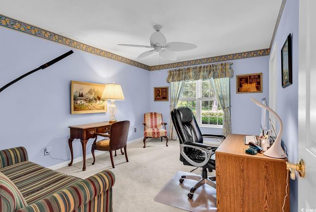 Home office with a ceiling fan and light colored carpet | Image 14