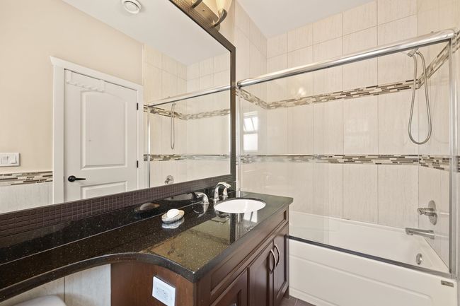 Full bath with vanity and bath / shower combo with glass door | Image 20