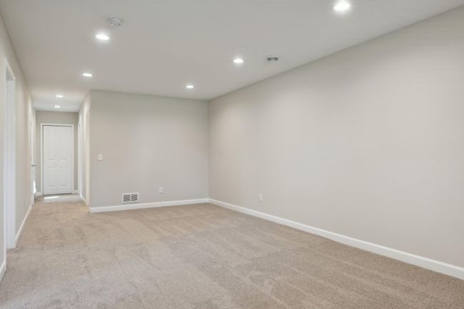 One last view of this family room. Again, fresh and clean. This space is adjacent to two additional bedrooms and a spacious bathroom. | Image 35