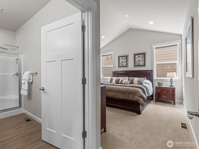 Plush carpet leads you into the generously sized primary bedroom. | Image 16