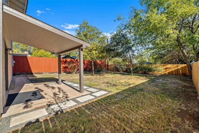 There is a great sized covered patio that is perfect place to entertain and enjoy the backyard. | Image 29