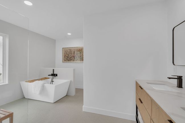 Bathroom featuring recessed lighting, a sink, a freestanding bath, and double vanity | Image 25