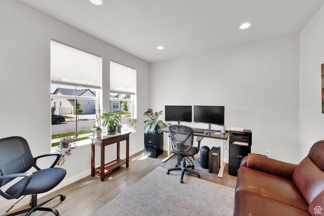 Home office with wood finished floors and recessed lighting | Image 12