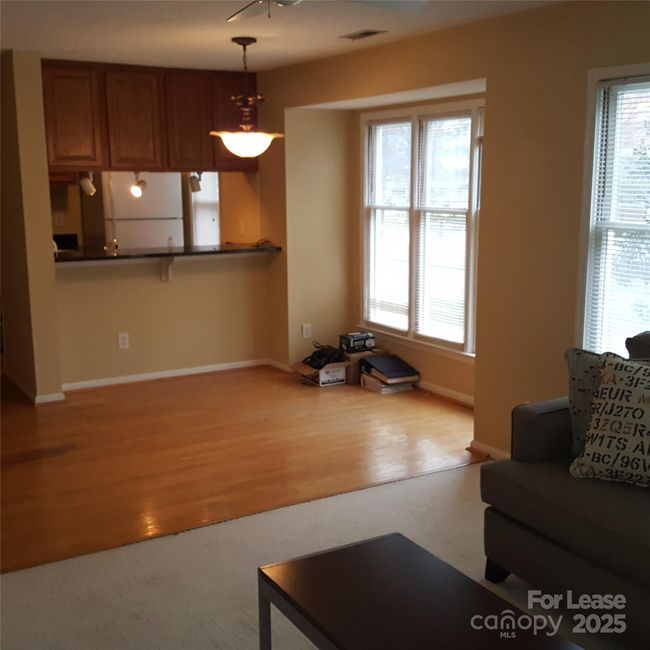Hardwood floor in foyer, kitchen and, dining areas. | Image 21