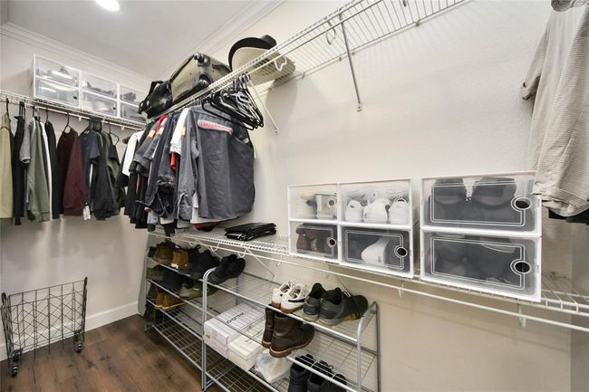 Large walk-in closet with hard surface flooring. | Image 20