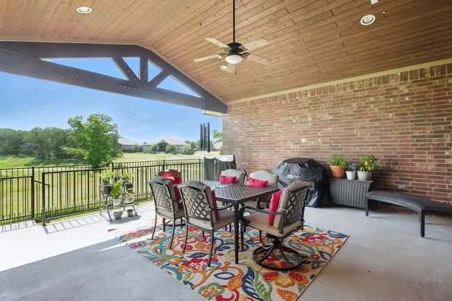 View of patio / terrace with ceiling fan, outdoor dining area, and a grill | Image 29