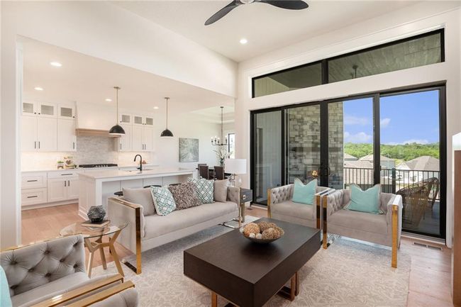 Living area featuring light wood-style flooring, recessed lighting, and ceiling fan | Image 6