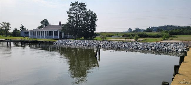 Dock area featuring a water view | Image 12