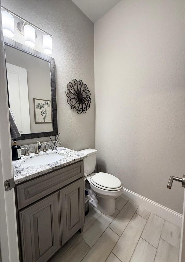 Half bath near the garage and laundry room. | Image 21