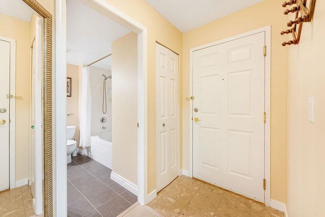 Foyer with light tile patterned flooring and baseboards | Image 19