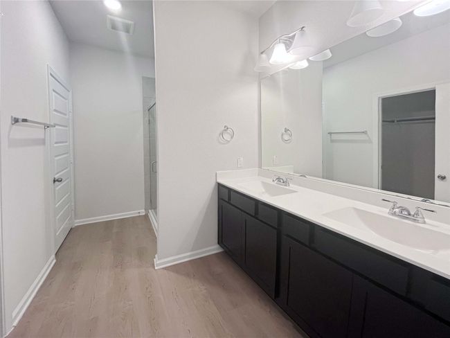 Owner's Bathroom with Dual Sinks and Walk-in Shower. Home under construction. Sample floor plan photo used for illustrative purposes only. Upgrades, selections options, windows and colors may vary. | Image 10