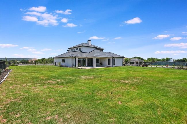 Back of house featuring a patio area, and expansive yard | Image 34
