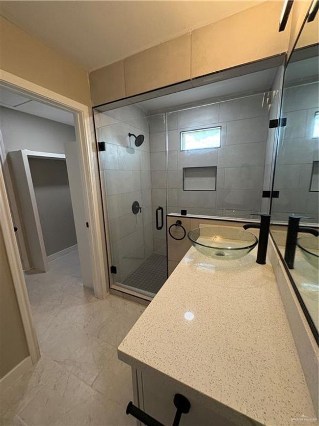 Bathroom featuring vanity and a stall shower | Image 13