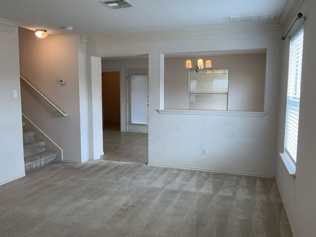 Living room featuring carpet flooring and crown molding | Image 7