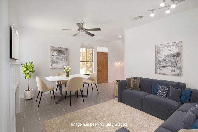 Virtually staged to show one option as to how you could arrange Living and Dining in this room. | Image 5
