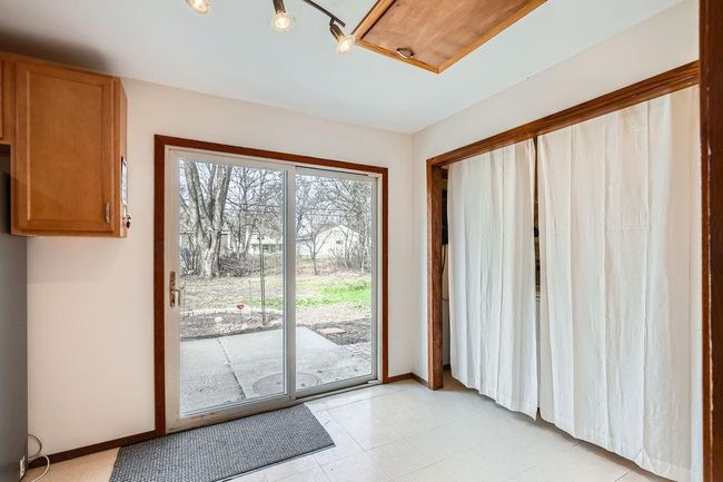 Eat in dining space in kitchen leads to the lovely back yard. Laundry and utilities all on one level - no basement. | Image 12