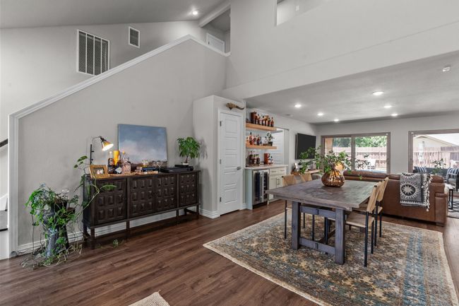 Dining space featuring vaulted ceiling | Image 11