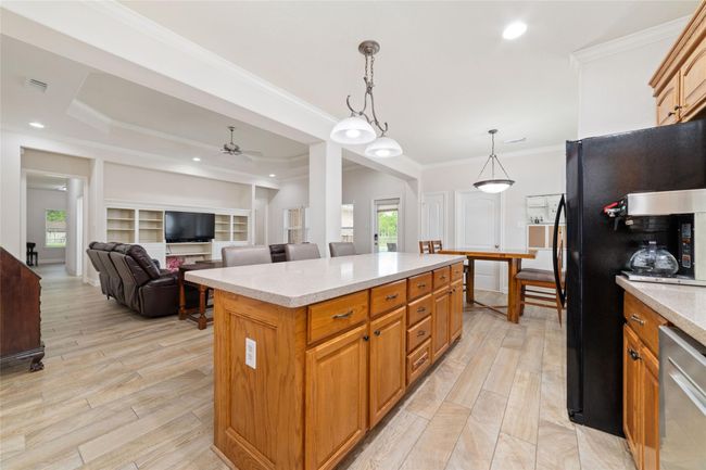 Kitchen with huge island with breakfast bar. | Image 20