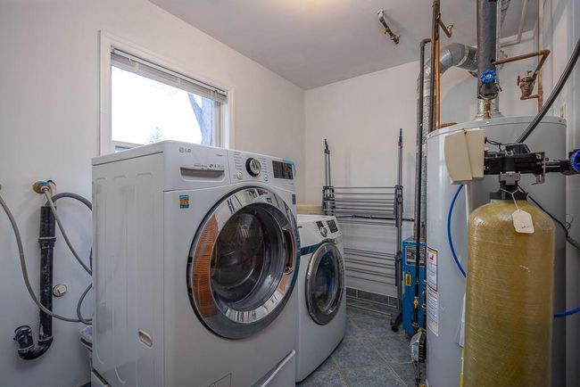 Freshly painted laundry and utility room with washer, dryer, furnace and hot water heater | Image 28