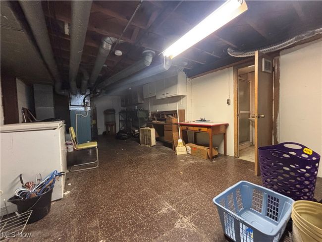 Unfinished below grade area featuring visible vents and tile patterned floors | Image 19