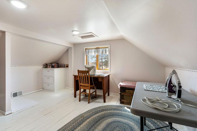 Second upper level bedroom currently used for crafting | Image 28