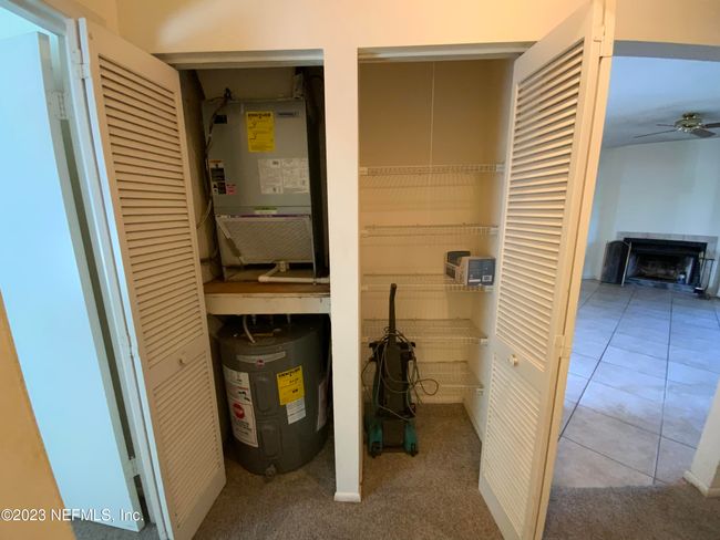 HVAC and water heater in the left closet. Linen closet on the right side | Image 22
