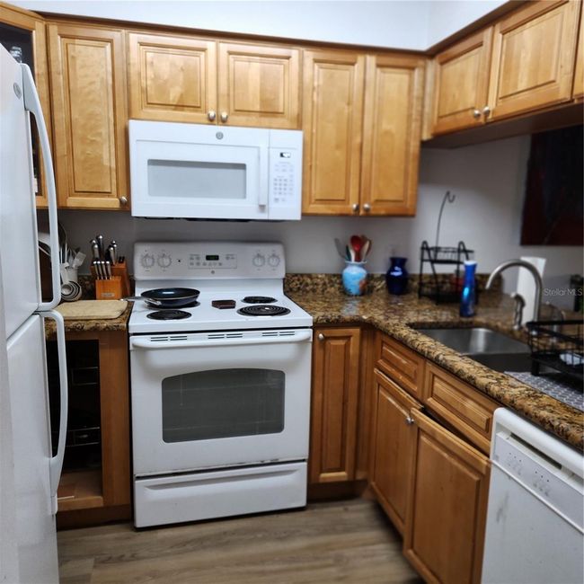 Kitchen with updated cabints & counters | Image 4