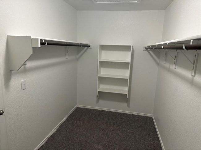 Spacious closet with carpet floors | Image 19