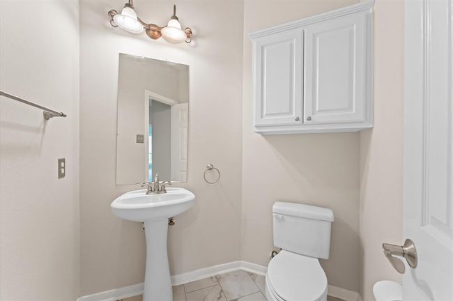 Conveniently situated on the first floor, the guest powder is a practical addition, for hosting guests. Give and enhance the overall convenience of the home for residents and visitors. | Image 37