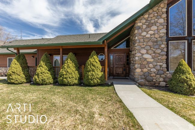 View of exterior entry with a lawn | Image 13