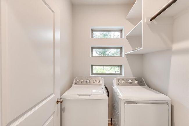 Laundry area with washer and clothes dryer and plenty of natural light | Image 27
