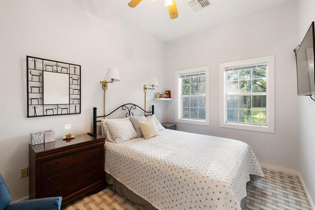 One of two guest bedrooms. The pool house also includes a full bath. | Image 40