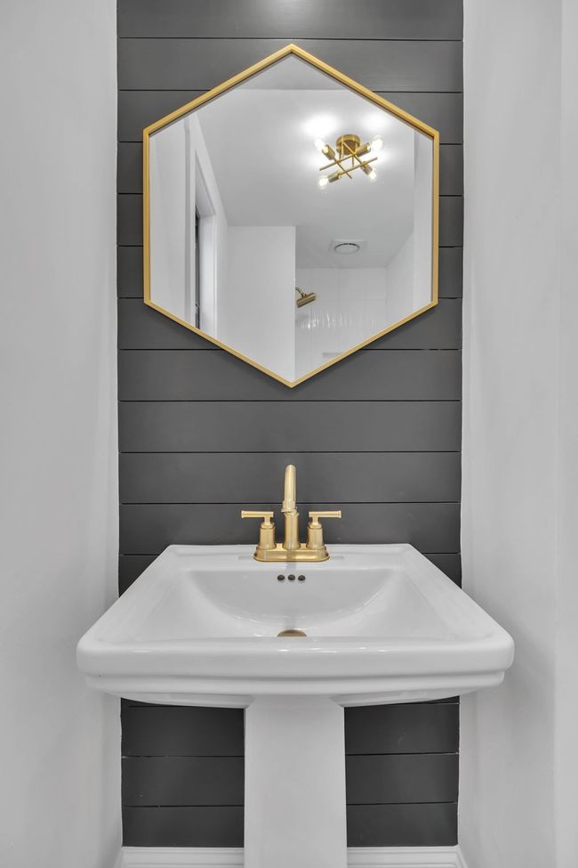 Full bathroom downstairs with shiplap accent wall. | Image 28