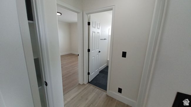 Hall featuring light wood finished floors and baseboards | Image 12