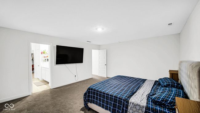 carpeted bedroom with baseboards | Image 31
