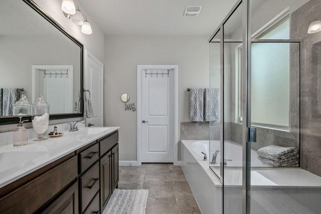 Full bathroom with plenty of natural light, double vanity, a garden tub, and a shower stall | Image 12