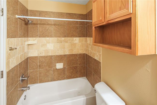 Hall bath with tiled tub surround | Image 19
