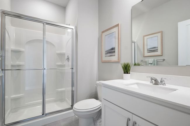 Desirable main floor bedroom and 3/4 bath perfect for guests or working from home. Model photo. Options and colors will vary. | Image 12