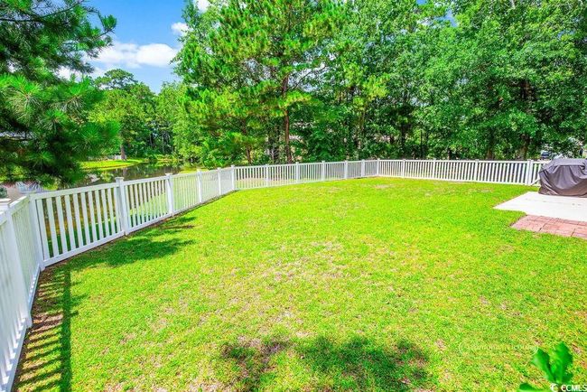 View of fenced backyard | Image 32