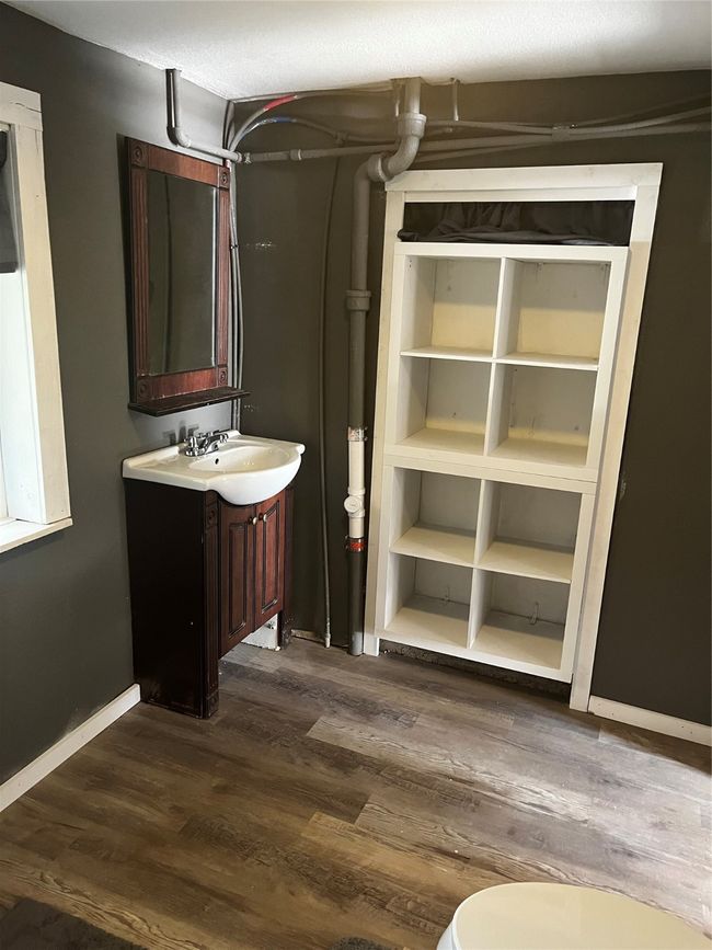 Shelving/utility storage in new bathroom in converted garage living quarters | Image 15