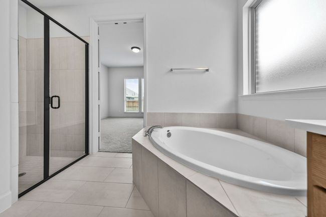 Full bath with a bath, a shower stall, and tile patterned floors | Image 16