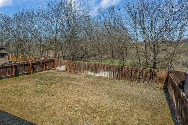 View of yard featuring a fenced backyard | Image 25