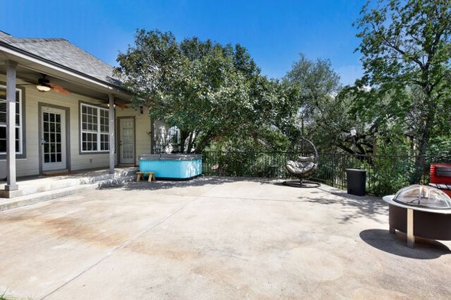 View of patio / terrace featuring a hot tub, a ceiling fan, and a fire pit | Image 29